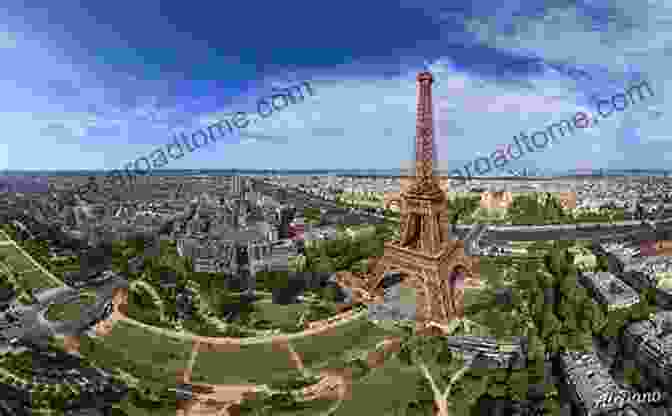 A Panoramic View Of The Eiffel Tower And The Champ De Mars With Cherry Blossoms In Full Bloom Evo S Travels J A Parris