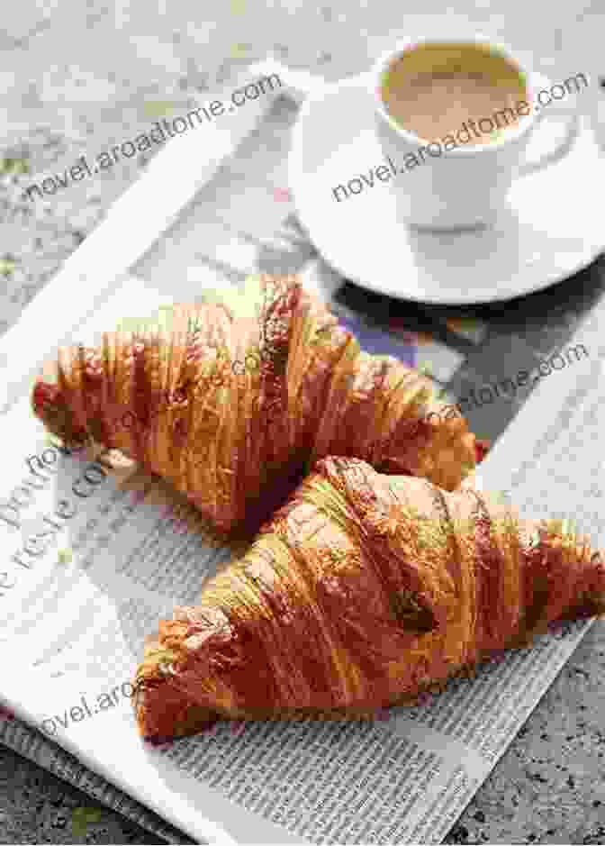 A Plate Of Freshly Baked Croissants And A Cup Of Coffee At A Sidewalk Cafe In Paris Evo S Travels J A Parris