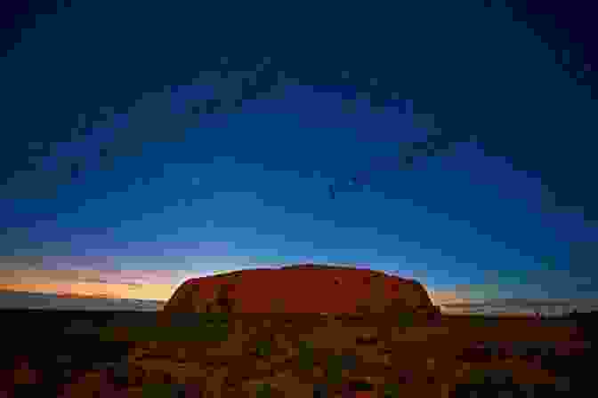 Beneath The Vast Expanse Of The Outback Sky, Studded With Countless Stars, Barfield Contemplates The Cyclical Rhythms Of Nature And The Interconnectedness Of All Life. FINDING ULURU Raymond Barfield