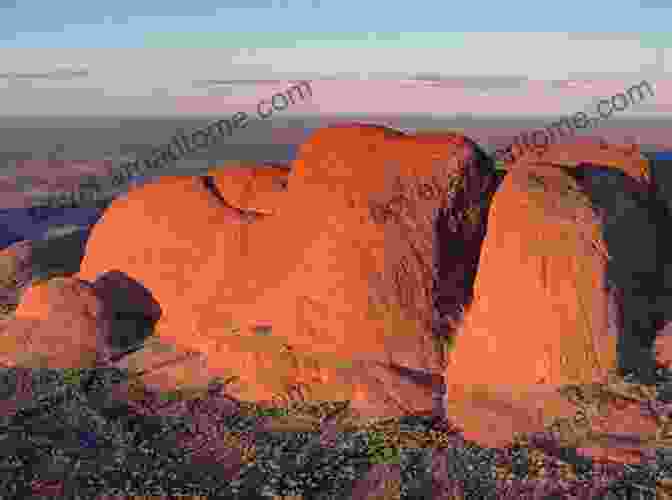 The Awe Inspiring Domes Of Kata Tjuta Rise From The Desert Landscape, Their Weathered Surfaces Bearing Witness To The Eons Of Time That Have Shaped This Ancient Land. FINDING ULURU Raymond Barfield